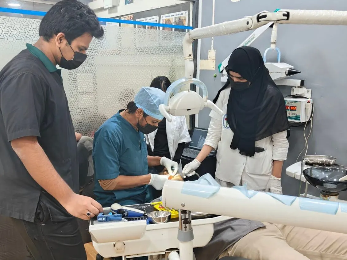 The dental team treating a patient at Vinaykia Dental Care